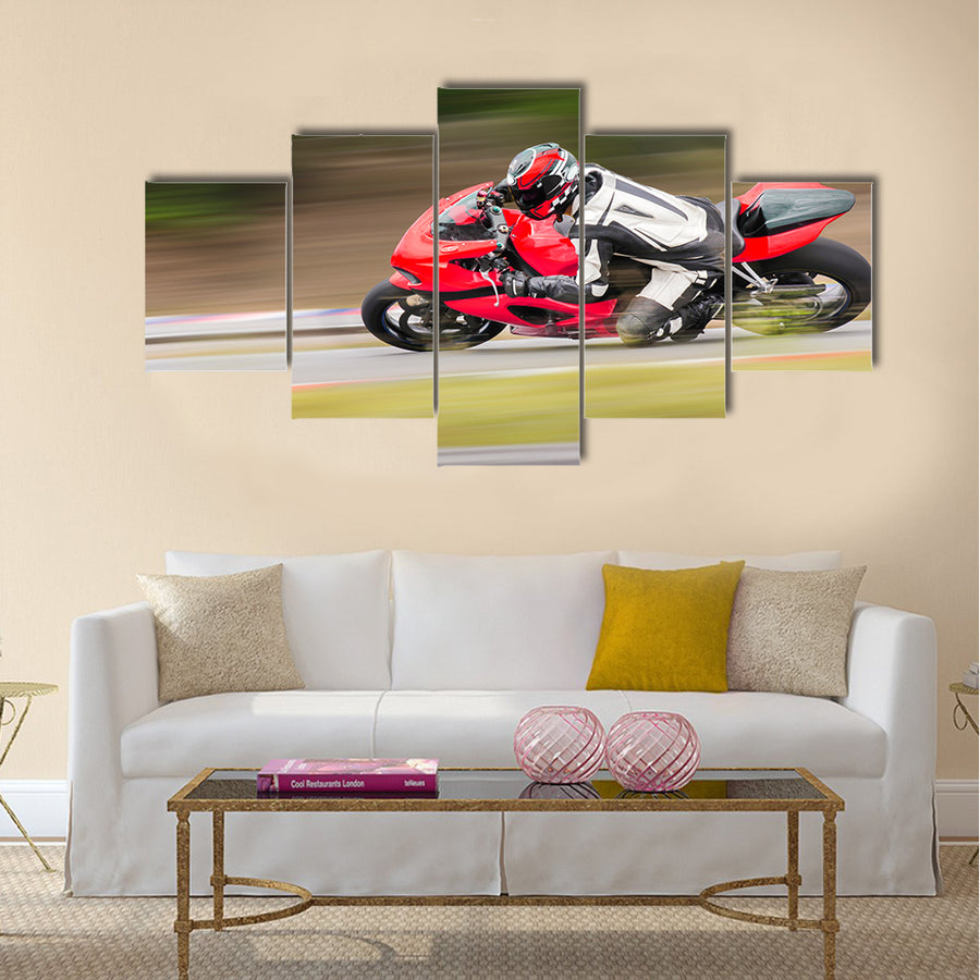 Motorcycle practice leaning into a fast corner on track Multi panel canvas wall art