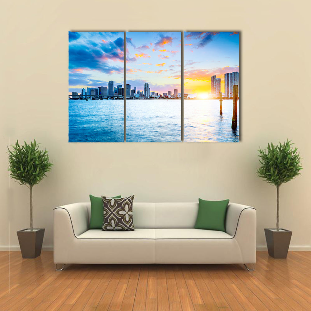 Miami city skyline panorama at dusk with urban skyscrapers over sea with reflection multi panel canvas wall art