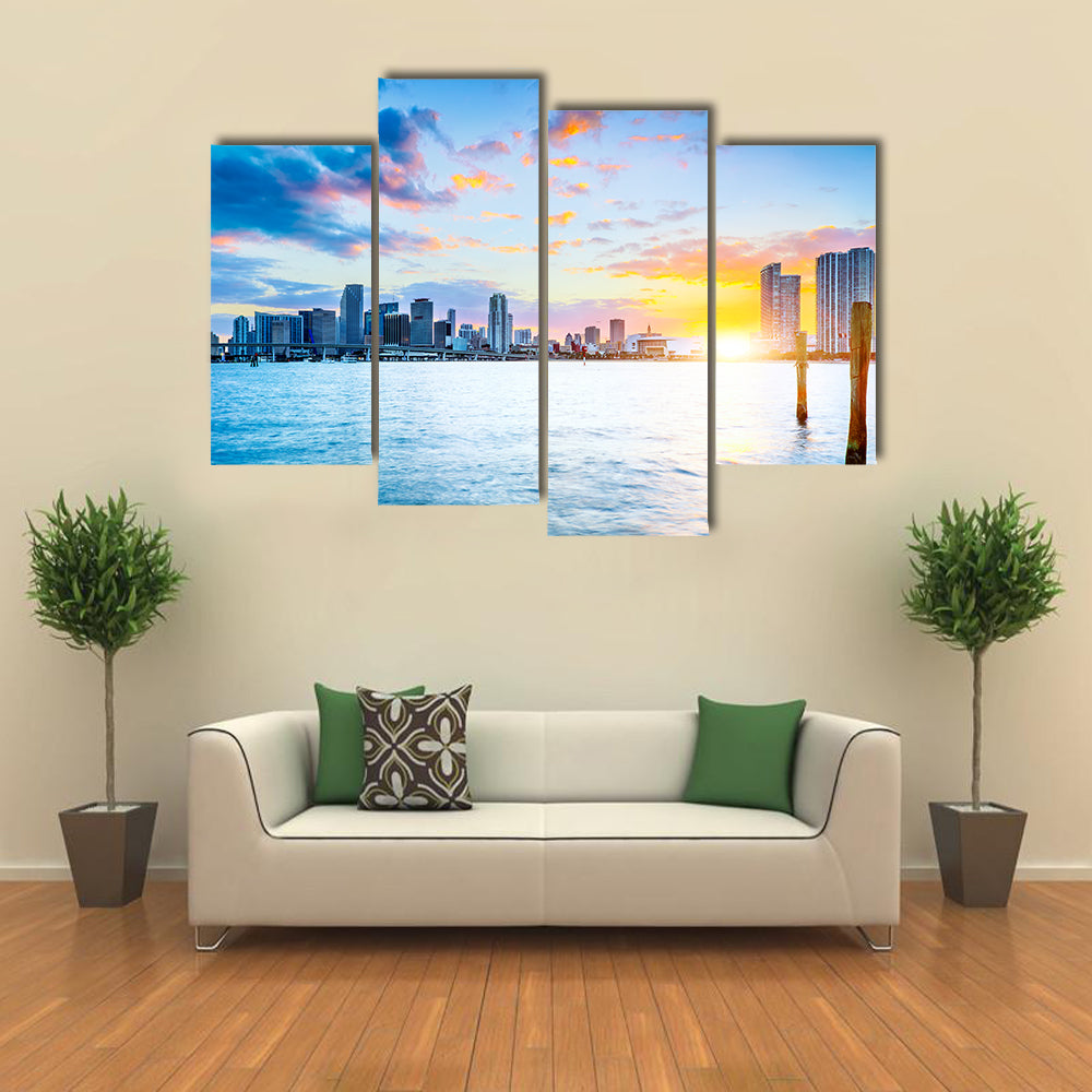 Miami city skyline panorama at dusk with urban skyscrapers over sea with reflection multi panel canvas wall art