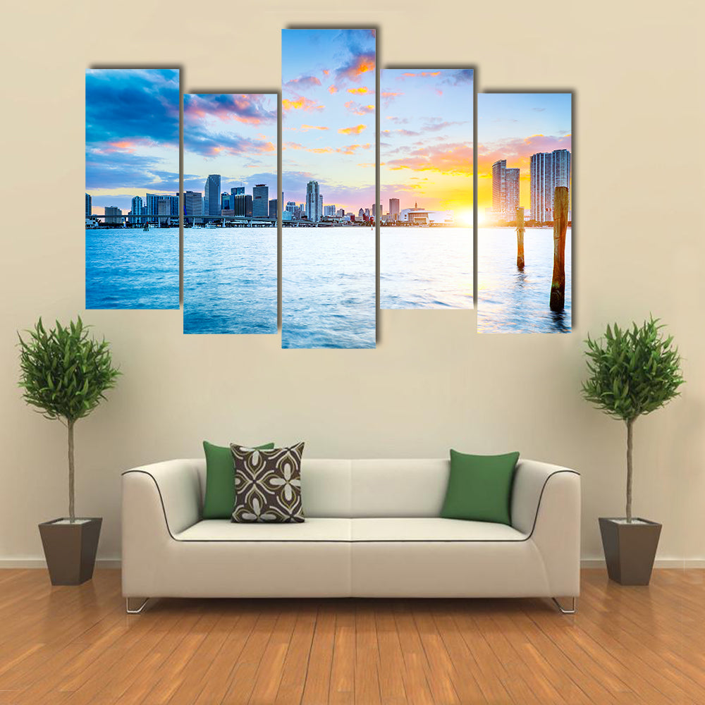 Miami city skyline panorama at dusk with urban skyscrapers over sea with reflection multi panel canvas wall art