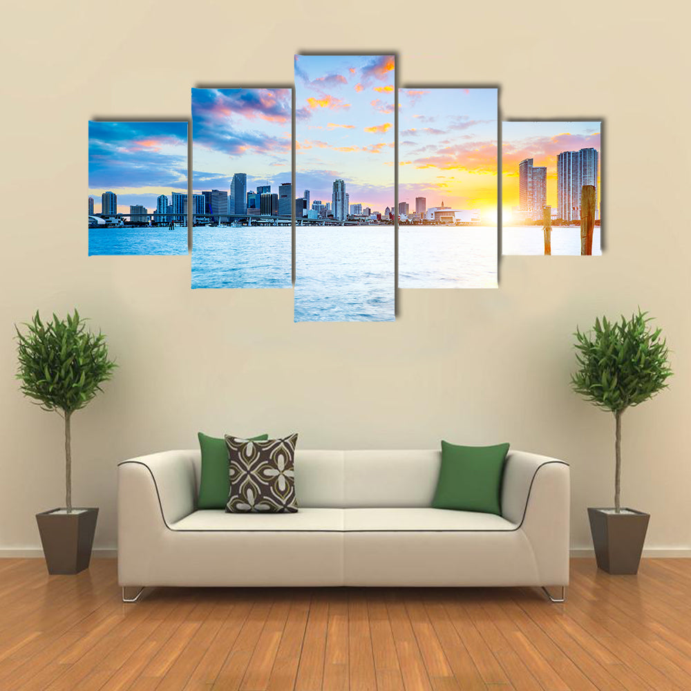 Miami city skyline panorama at dusk with urban skyscrapers over sea with reflection multi panel canvas wall art