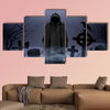 Faceless angel of death in loose overall among graves in the cemetery multi panel canvas wall art