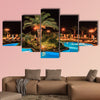 Tropical swimming pool in night view multi panel canvas wall art