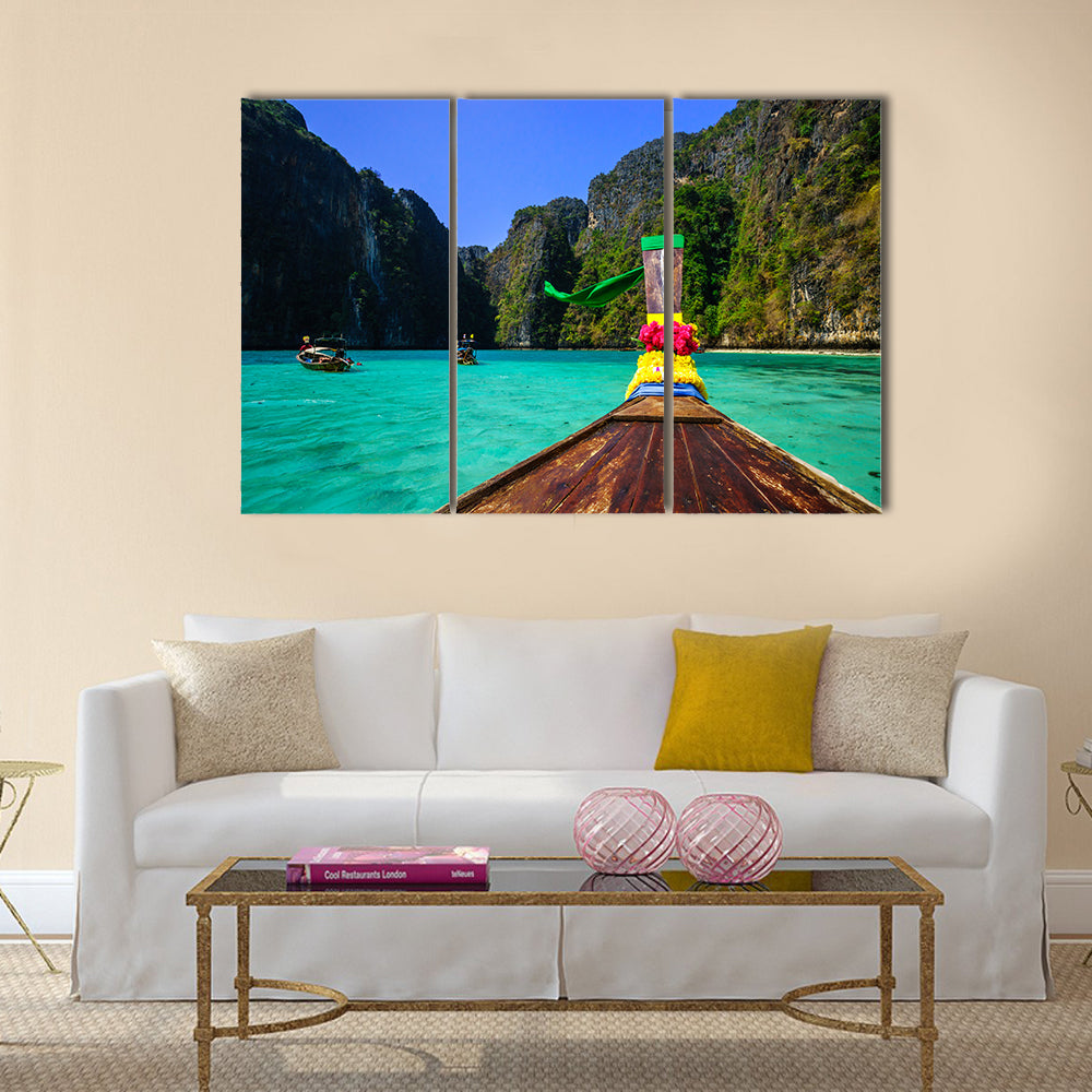 Traditional long tail boat in Pile Bay Multi Panel Canvas Wall Art