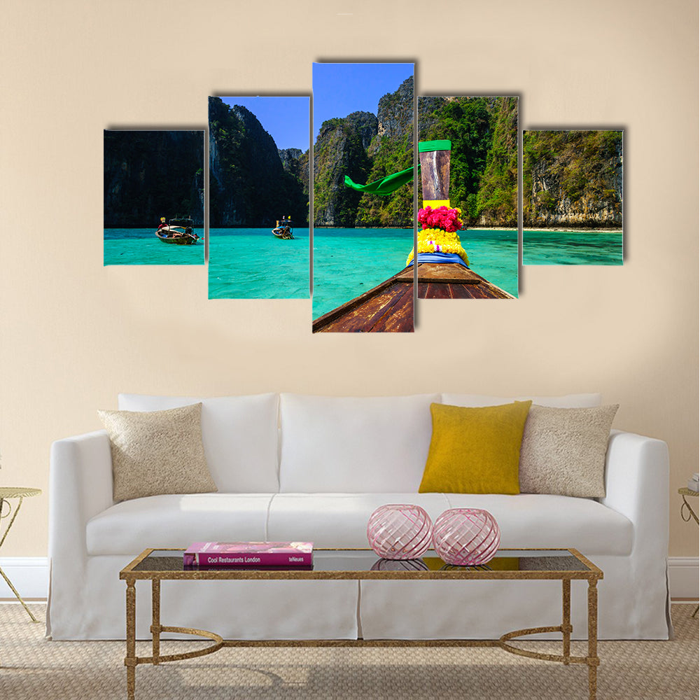 Traditional long tail boat in Pile Bay Multi Panel Canvas Wall Art