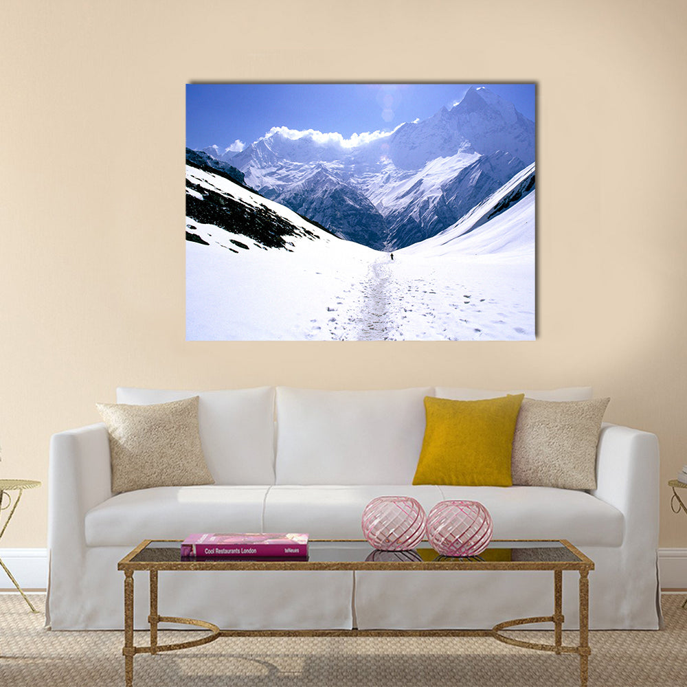 On the way to Annapurna Base Camp in Nepal, a man treks alone Multi panel canvas wall art