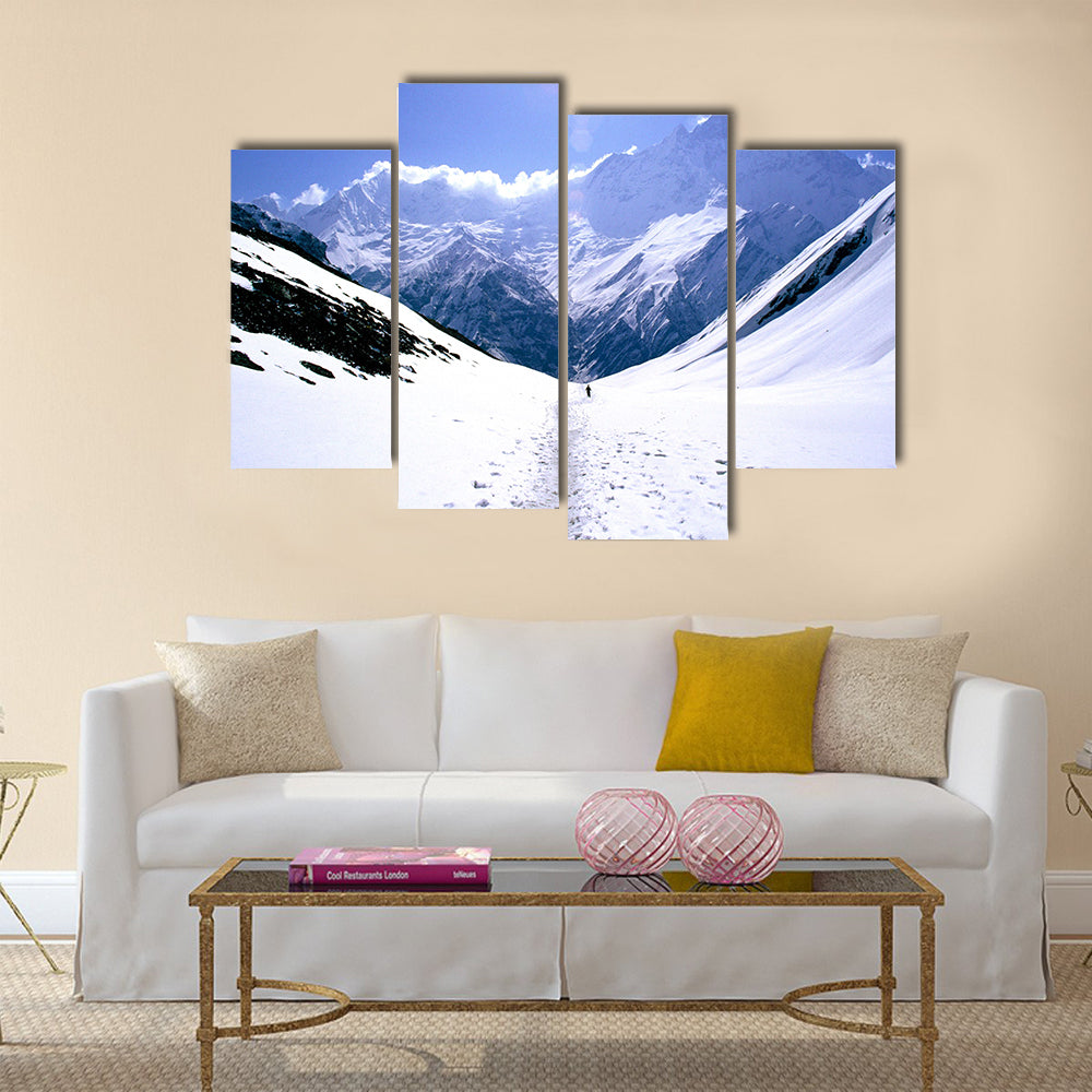 On the way to Annapurna Base Camp in Nepal, a man treks alone Multi panel canvas wall art