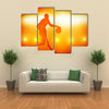 Basketball player silhouette dribbling with lights Multi panel canvas wall art