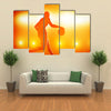 Basketball player silhouette dribbling with lights Multi panel canvas wall art