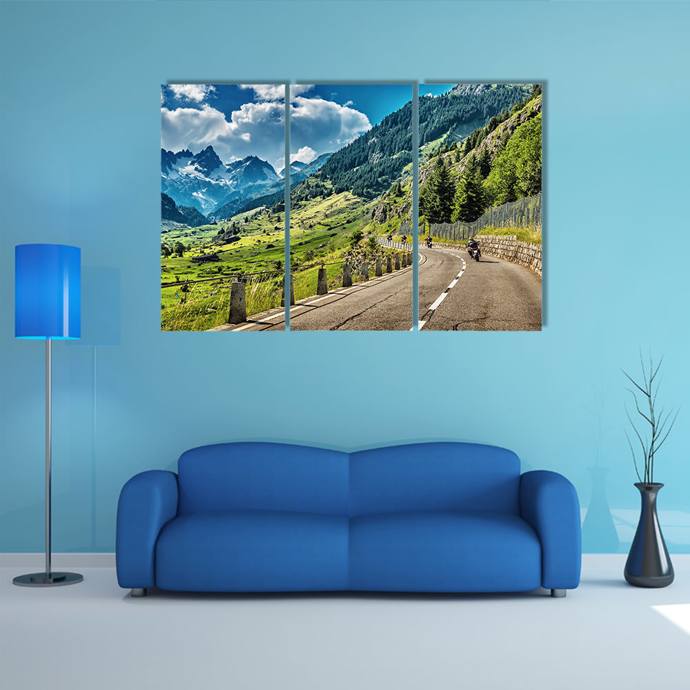 A Group of bikers touring on mountainous road Multi Panel Canvas Wall Art