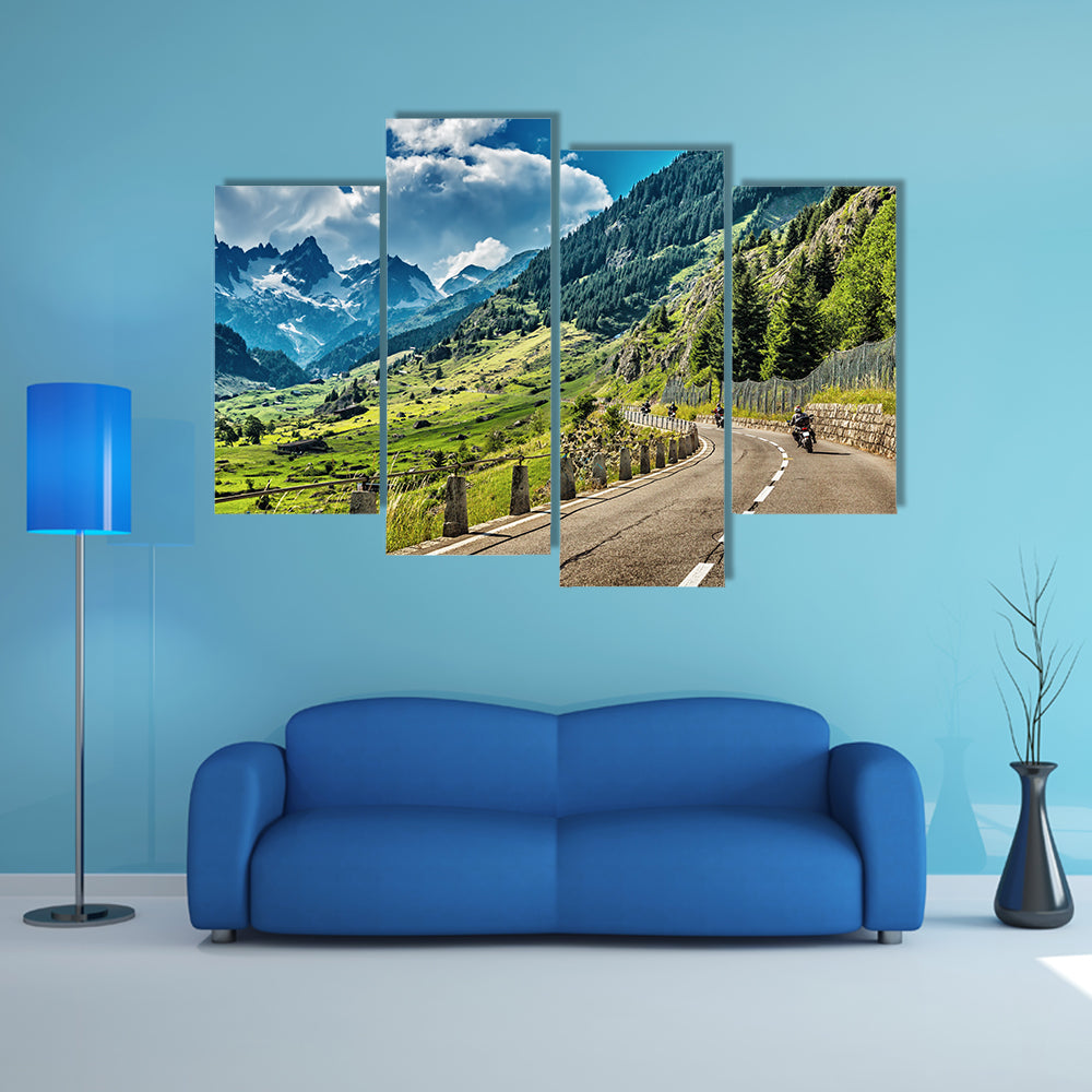 A Group of bikers touring on mountainous road Multi Panel Canvas Wall Art