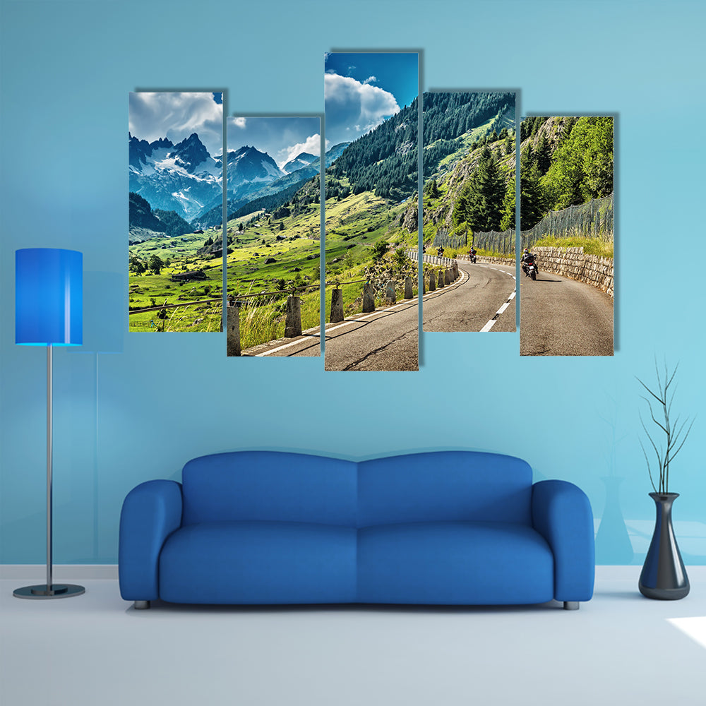 A Group of bikers touring on mountainous road Multi Panel Canvas Wall Art