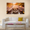 Biker driving a motorcycle rides along the asphalt road. First-person view Multi panel canvas wall art