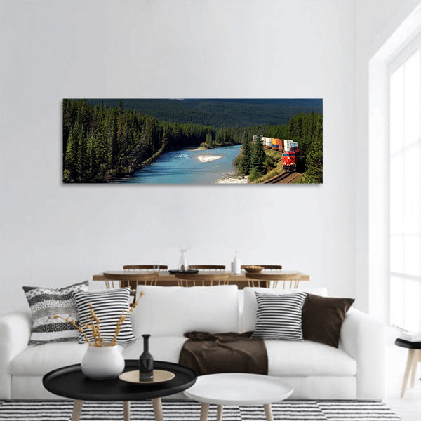 Freight train moving along Bow river in Canadian Rockies panoramic canvas wall art