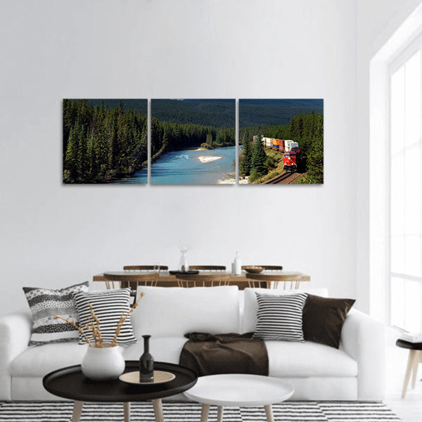 Freight train moving along Bow river in Canadian Rockies panoramic canvas wall art