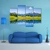 Idyllic summer landscape with clear mountain lake in the Alps multi panel canvas wall art