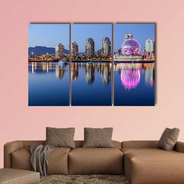 A beautiful clear summer night in Vancouver, BC features a pink glowing wall art