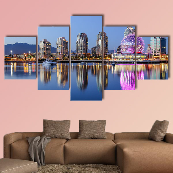 A beautiful clear summer night in Vancouver, BC features a pink glowing wall art