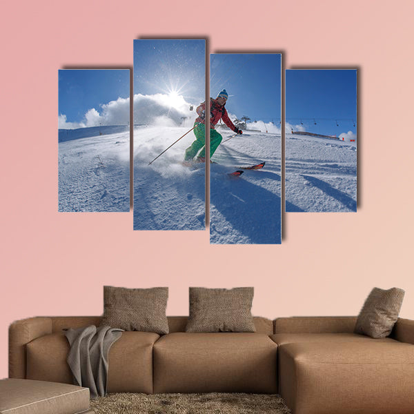 Skier skiing downhill in high mountains against sunset Multi panel canvas wall art
