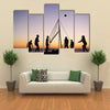 people playing beach volleyball on the beach in Brittany Multi panel canvas wall art