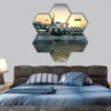 Science fiction island city with metallic ring structures hexagonal canvas wall art