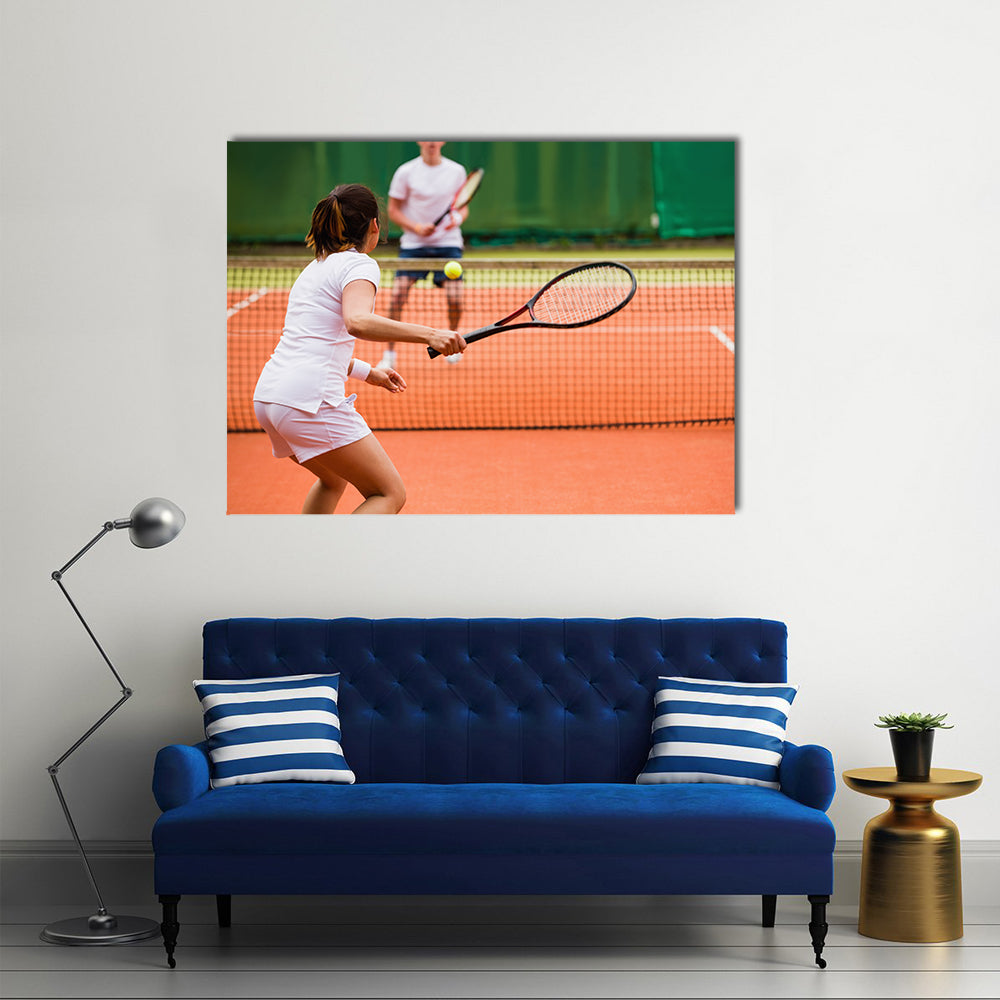 Tennis players playing a match on the court on a sunny day Multi panel canvas wall art