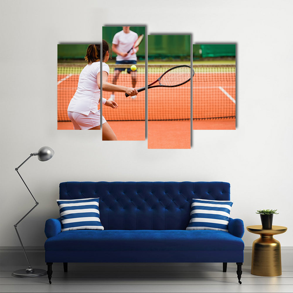 Tennis players playing a match on the court on a sunny day Multi panel canvas wall art
