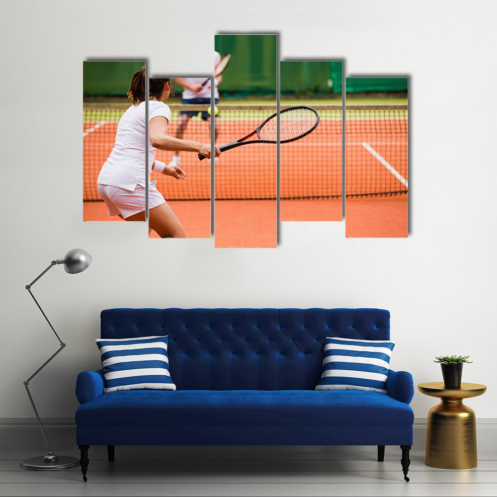 Tennis players playing a match on the court on a sunny day Multi panel canvas wall art