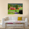 Beautiful old red farm houses in a rural landscape, Sweden canvas wall art