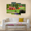 Beautiful old red farm houses in a rural landscape, Sweden canvas wall art