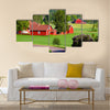 Beautiful old red farm houses in a rural landscape, Sweden canvas wall art