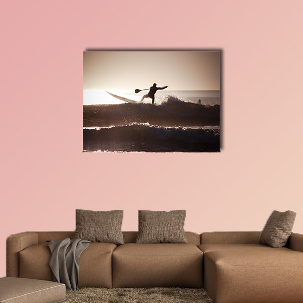 Silhouette of a man paddle boarding Multi panel canvas wall art