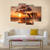 beautiful sunset with dolphins jumping multi panel canvas wall art