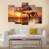 beautiful sunset with dolphins jumping multi panel canvas wall art