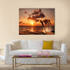 Beautiful sunset with dolphins jumping Multi Panel Canvas Wall Art