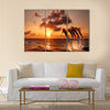 Beautiful sunset with dolphins jumping Multi Panel Canvas Wall Art