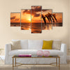 Beautiful sunset with dolphins jumping Multi Panel Canvas Wall Art