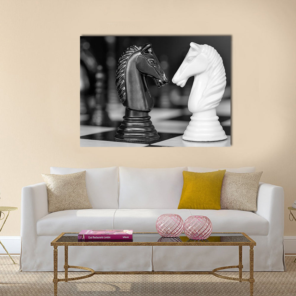 Chess knights head to head. Black and white image multi panel canvas wall art