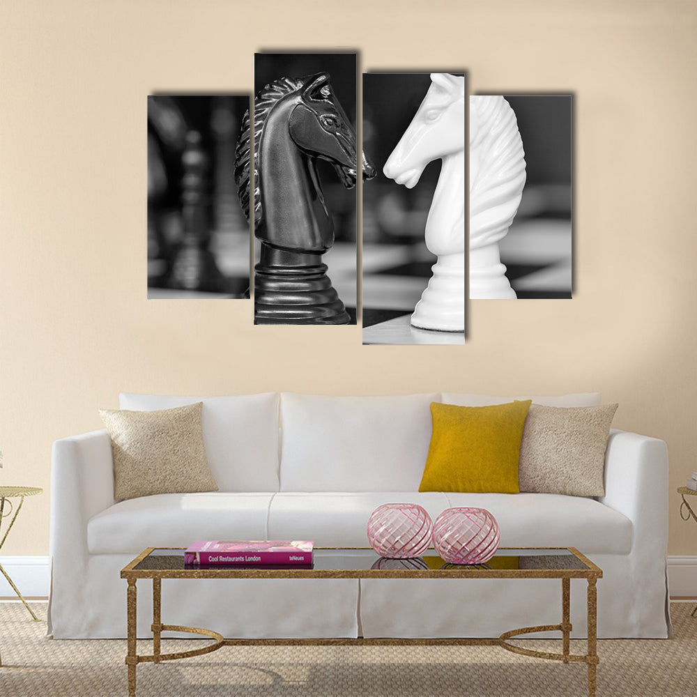 Chess knights head to head. Black and white image multi panel canvas wall art