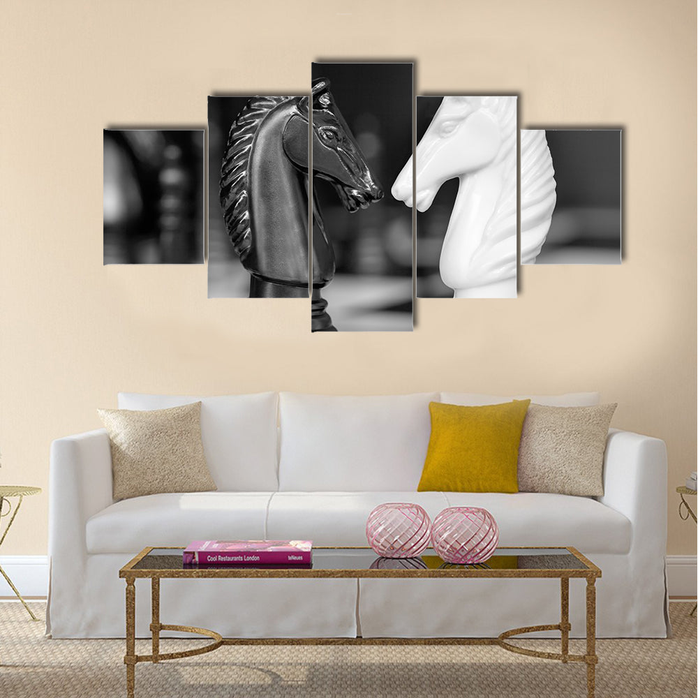 Chess knights head to head. Black and white image multi panel canvas wall art