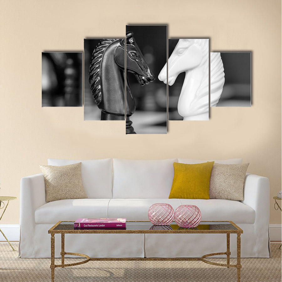 Chess knights head to head. Black and white image multi panel canvas wall art