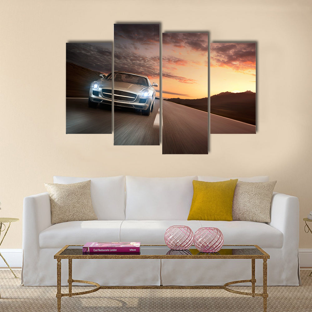 Luxury sports car speeding on a highway at the sunset Multi panel canvas wall art