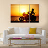 Motorcycle traveling the world girl resting on the beach road Multi panel canvas wall art