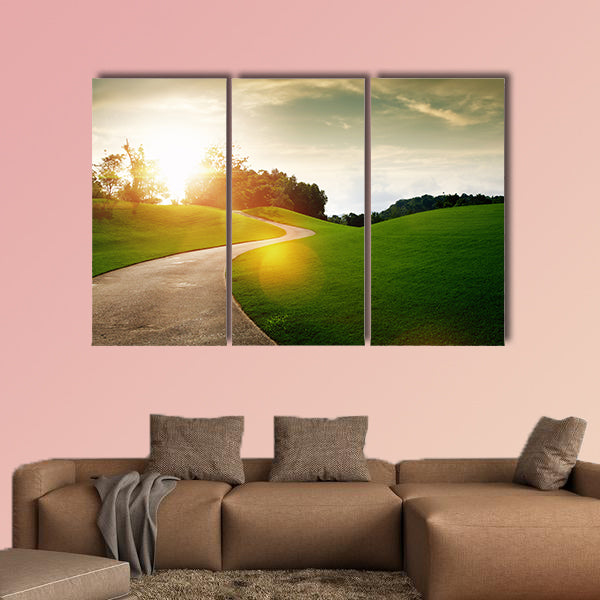 Panoramic view of nice green hill and path during sunset multi panel canvas wall art