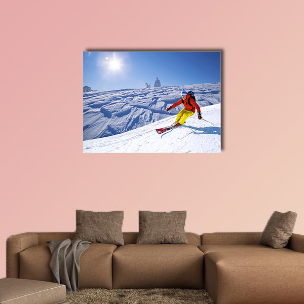 Skier skiing downhill in high mountains Multi panel canvas wall art