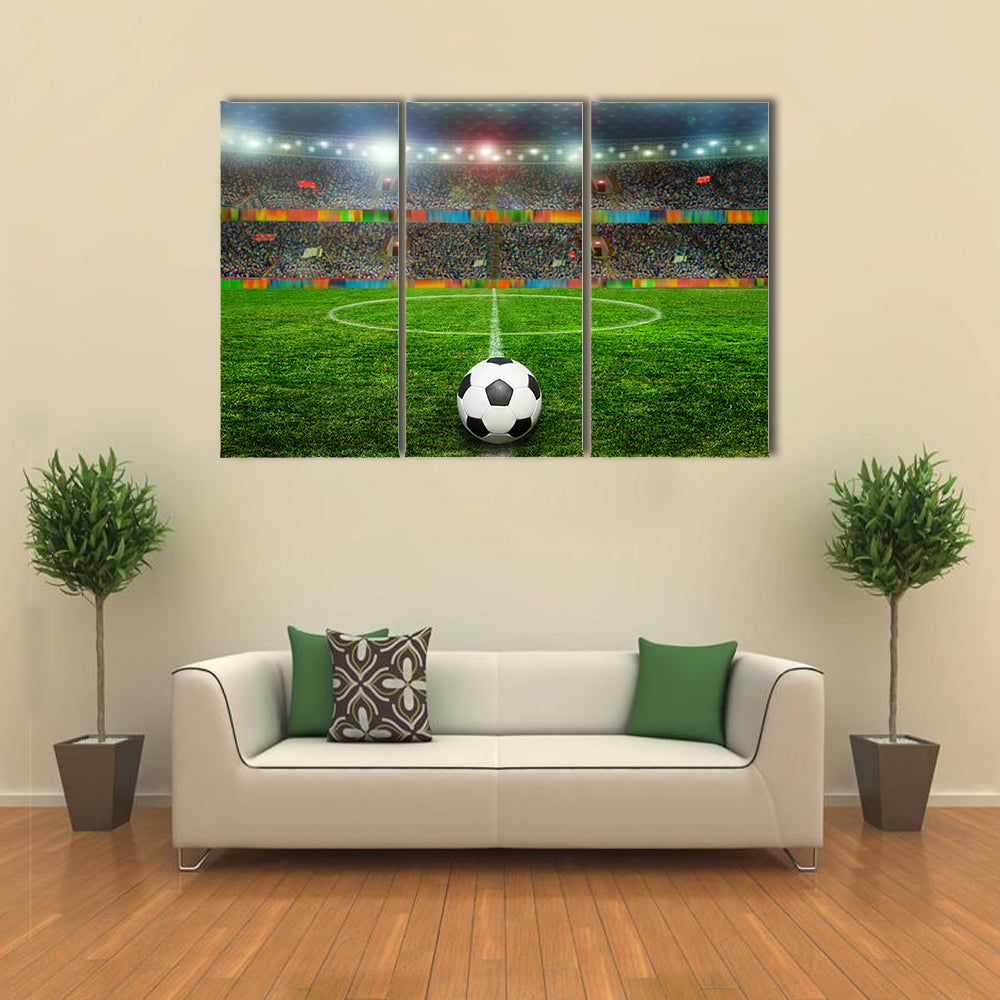 Soccer ball on the field of stadium with light Multi panel canvas wall art