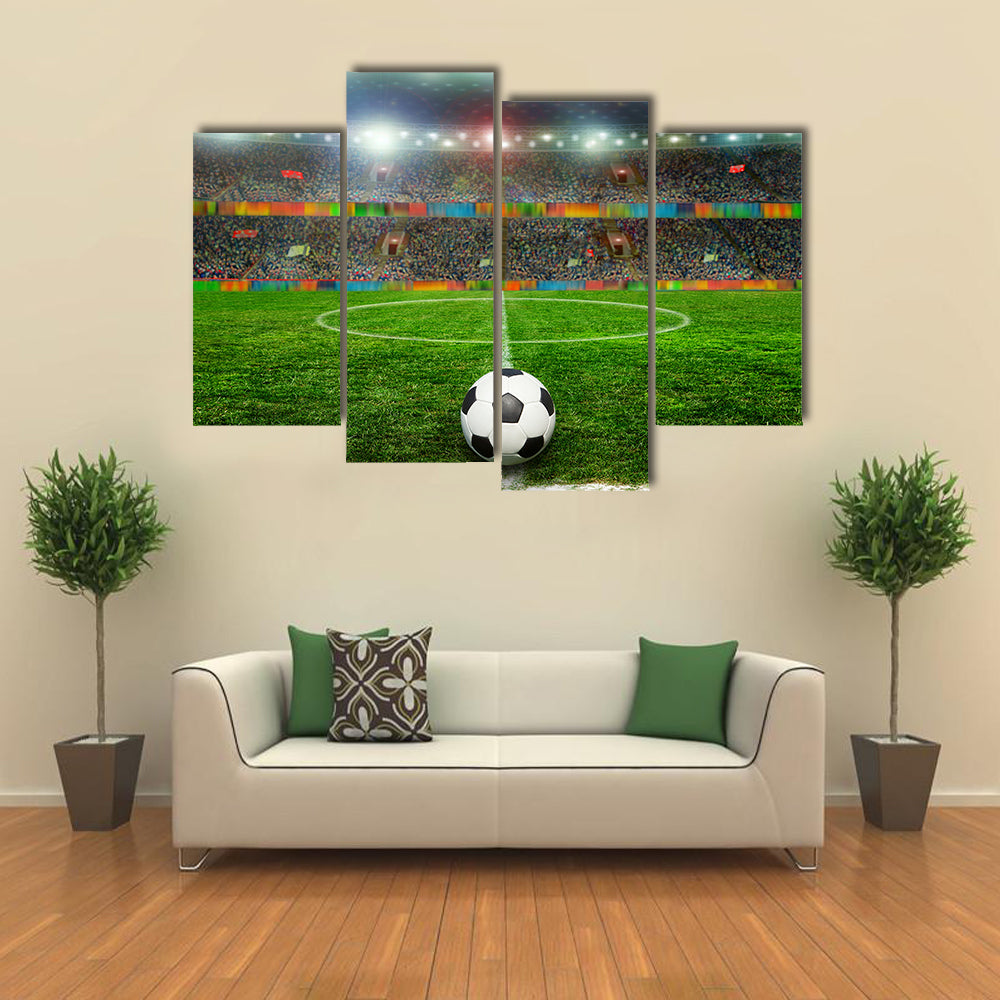 Soccer ball on the field of stadium with light Multi panel canvas wall art