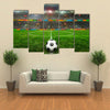 Soccer ball on the field of stadium with light Multi panel canvas wall art