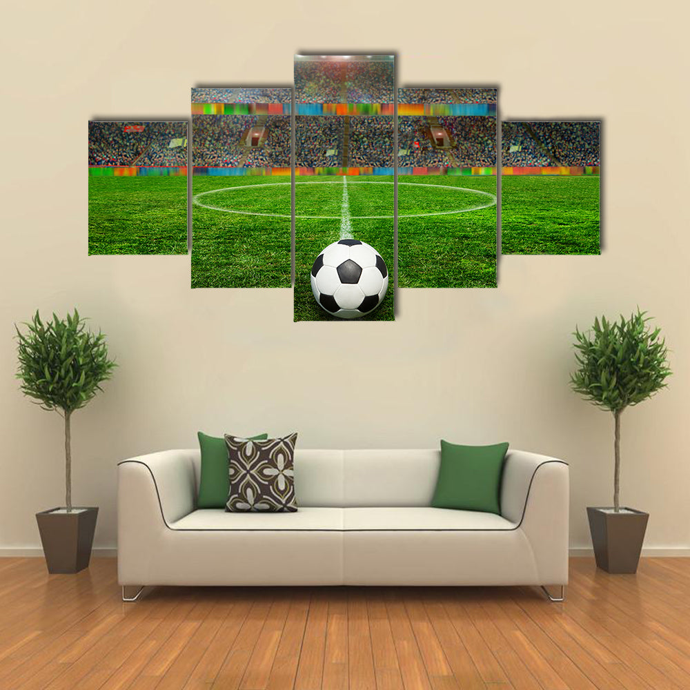 Soccer ball on the field of stadium with light Multi panel canvas wall art