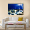 Multiple eletric lightning strikes over river Multi Panel Canvas Wall Art